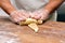 Baker making croissants on the wooden table