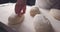 Baker Making Patterns On Raw Bread Using A Knife, slow motion 4k video