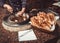 Baker making turkish pita bread in tandoor clay oven. Baking process.