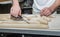 Baker prepares bread dough