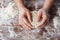 Baker prepares the dough on a wooden table, male hands knead the dough with flour