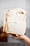 Baker\'s Hand Holding Stacked Bread Slices