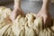 Baker\'s Hands Kneading Bread Dough