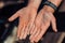 Baker`s married man`s hands palm with wedding ring covered with wheat lour, close-up selective focus macro shot with