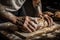 a baker, shaping and scoring a loaf of bread into diamonds