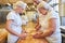 Baker team kneading the dough for the bread rolls