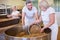 Baker team mixing grains in a vat