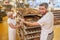 Baker team pushes a shelf trolley with fresh breads