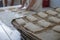 Baker And Tray of Fresh Ciabatta Bread Buns