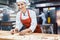 Baker woman forming pretzels and bread