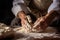 bakers hands shaping dough for artisan bread making