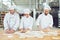 Bakers kneading dough in a bakery