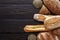 Bakery background, bread assortment on black