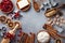 Bakery background with ingredients for cooking Christmas baking. Flour, brown sugar, butter, cranberry and spices top view