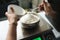 Bakery chef weighing flour on the digital scale