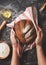 Bakery concept with bread and ingredients on black background with roll and man hands