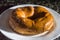 Bakery donut on a white donut with black background, copybspace and selective focus