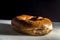 Bakery donut on a white donut with black background, copybspace and selective focus