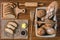 Bakery food background of assortment of bread in basket with sliced bread and butter and chocolate sauce on wooden plate