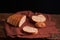 Bakery - gold rustic crusty loaves of bread and buns on black chalkboard background. Still life captured from above