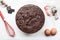 Bakery ingredients - flour, eggs, cocoa, chocolate on white table. Sweet pastry baking concept. Flat lay, copy space, top view