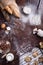 Bakery produce - bread, baguette, cookies over rustic background. Baking ingredients - flour, nuts, eggs, milk. Top view,