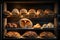 Bakery products in a bakery shop. Freshly baked buns, croissants, buns on a shelf in a bakery