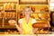 Bakery shopkeeper with two loafs of bread