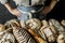 Bakery stall - rustic loaves of bread and shop assistant