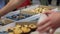 Bakery vendor selling delicious cakes at homemade food trade fair, confectionery