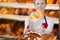 Bakery Worker Holding Bag Of Bread