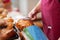 Bakery Worker Holding Bag Of Breads