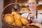 Bakery Worker Holding Bread Basket