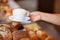 Bakery Worker Serving Cappuccino