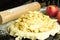 Baking an apple pie with apples and rolling pin