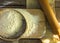 Baking background. Cooking ingredients for dough and pastry making and sprinkled with flour board on rustic wood. Top view with co