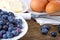 Baking blueberry pie - ingredients on old wooden background