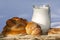 Baking bread and jug with milk