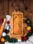 Baking cake with rolling pin on rural rustic wooden background flat lay. Dough recipe ingredients eggs wholegrain flour