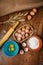 Baking cake in rural kitchen - dough recipe ingredients eggs, flour, sugar on vintage wooden table from above.