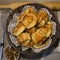 Baking with cottage cheese in a wicker basket set with a wooden rolling pin and a metal whisk