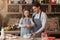 Baking With Dad. Girl helping father prepare dough for cookies in kitchen