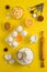 Baking flat lay background with eggs floor butter lemon sieve