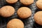 Baking grid with Danish butter cookies on table