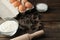 Baking ingredients, cookie molds and baking tools on a brown wooden table