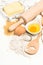 Baking ingredients eggs, flour, sugar, butter. kitchen utensils