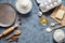 Baking ingredients for homemade pastry on dark background. Bake sweet cake dessert concept. Top view, flat lay