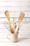 Baking kitchenware and baking products on white wooden background