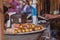The baking of Kurtoskalacs, the traditional hungarian spit cake, in a pastry shop. Festival (Kï¿½rtoskalï¿½cs Fesztivï¿½l) in Buda