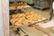 baking pastries and bread in an oven at a bakery